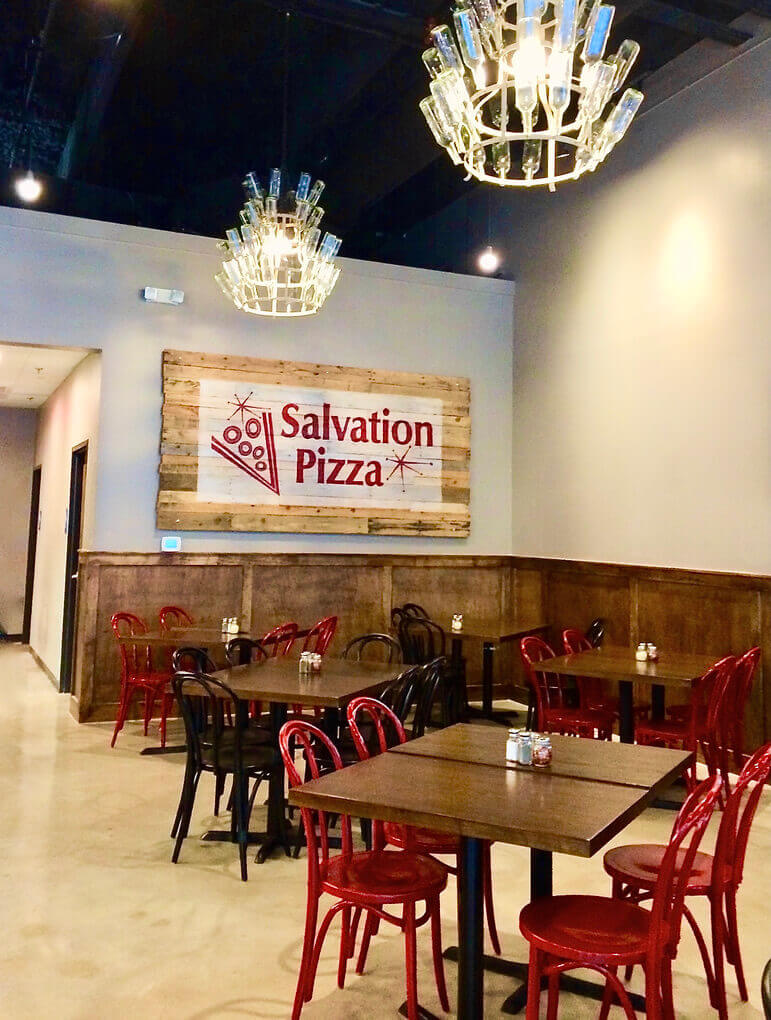 Tables at Salvation Pizza on Rainey Street in Austin, Texas