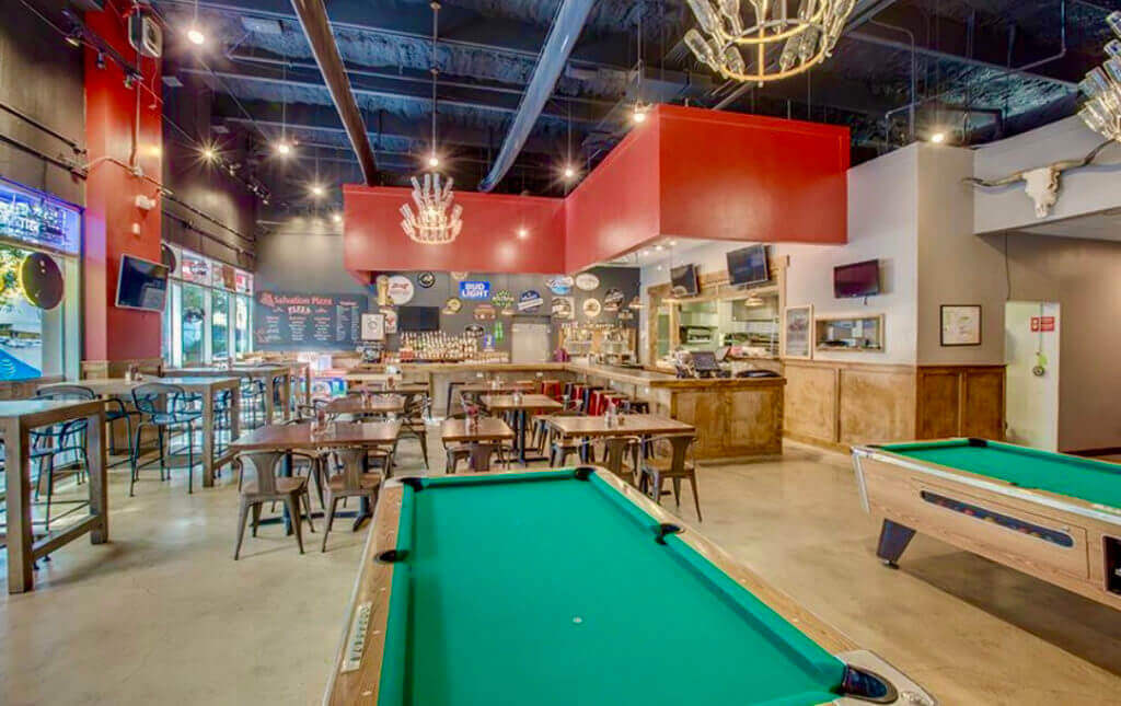 Pool table and bar area in Salvation Pizza at Domain Northside in Austin, Texas