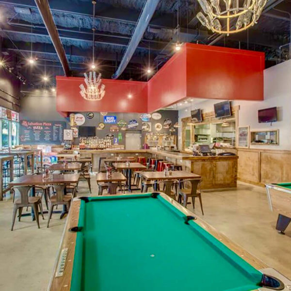 Pool table and bar area in Salvation Pizza at Domain Northside in Austin, Texas