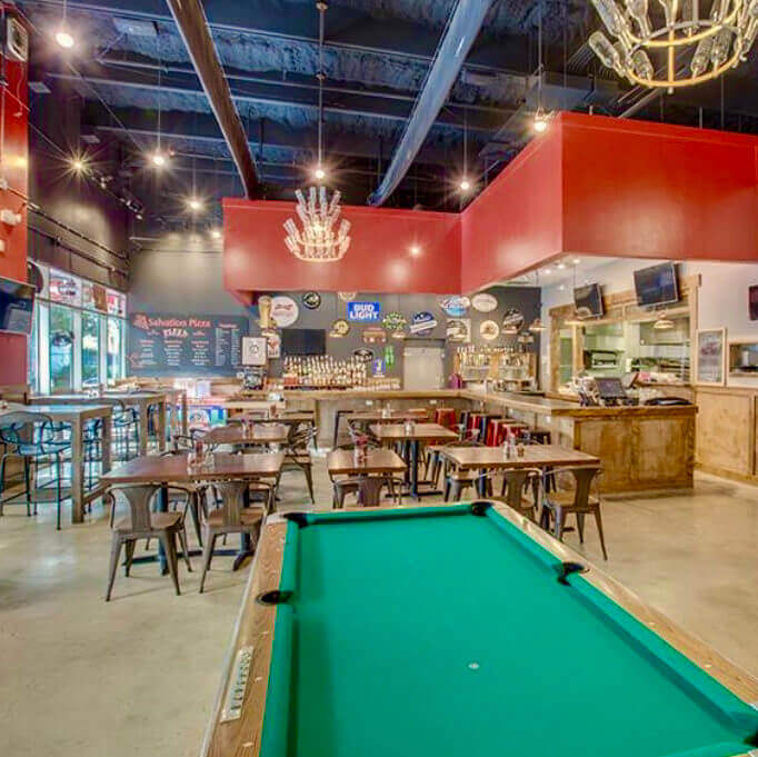 Pool table and bar area in Salvation Pizza on Rainey Street in Austin, Texas