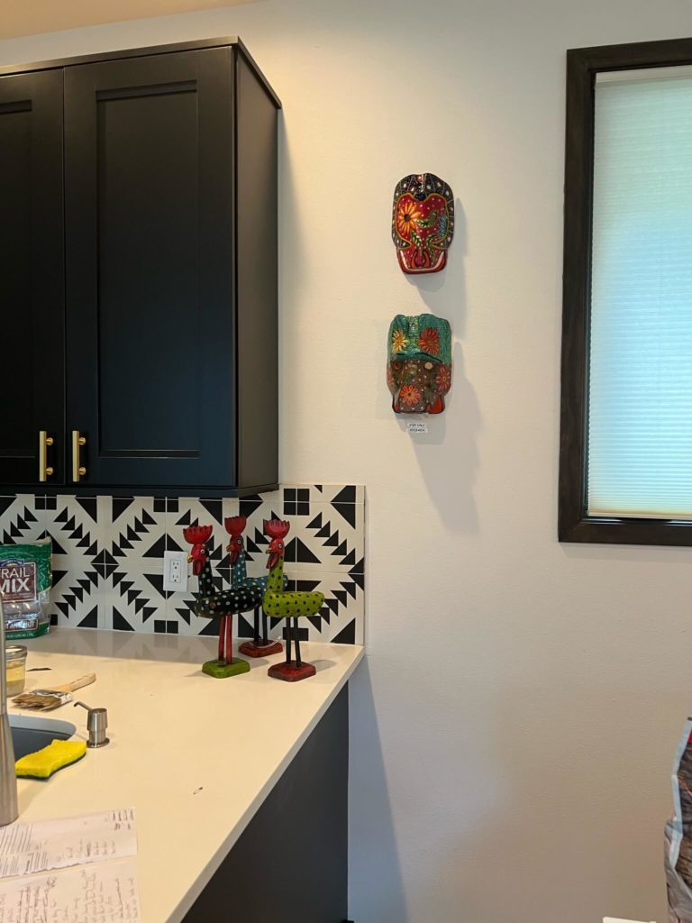 Guatemalan masks in kitchen of Bouldin Creek Airbnb in South Austin, Texas