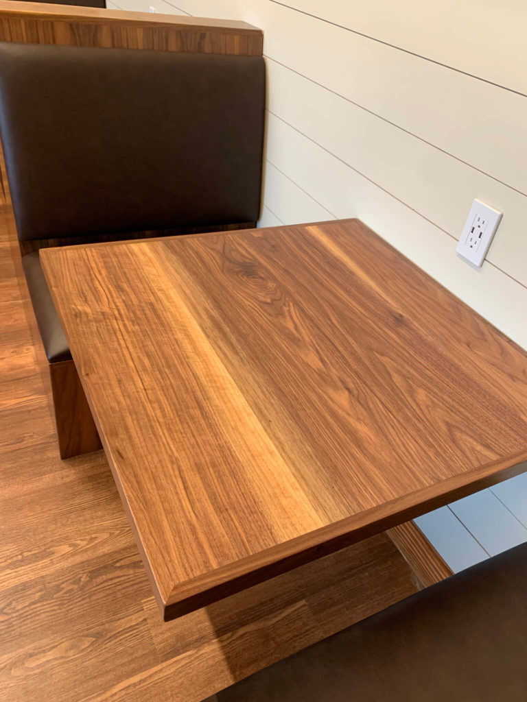 Custom wood table at University of Texas Women's Golf lounge