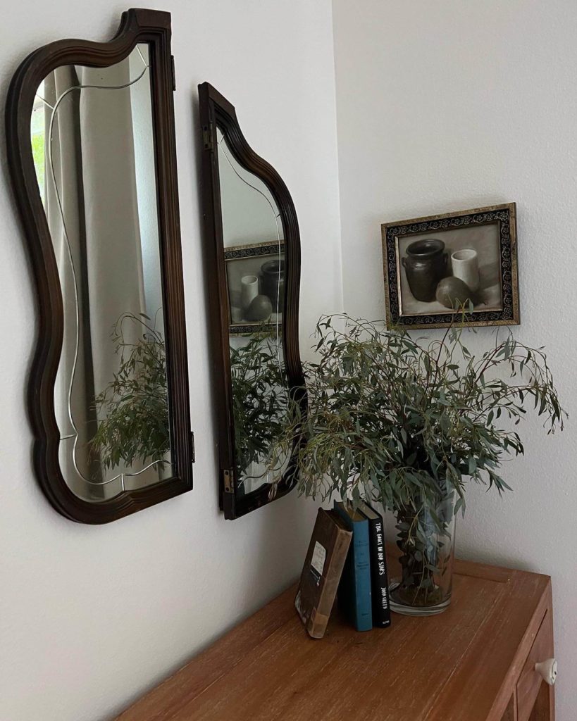 Vanity mirrors and flowers in Bouldin Creek Airbnb in South Austin, Texas