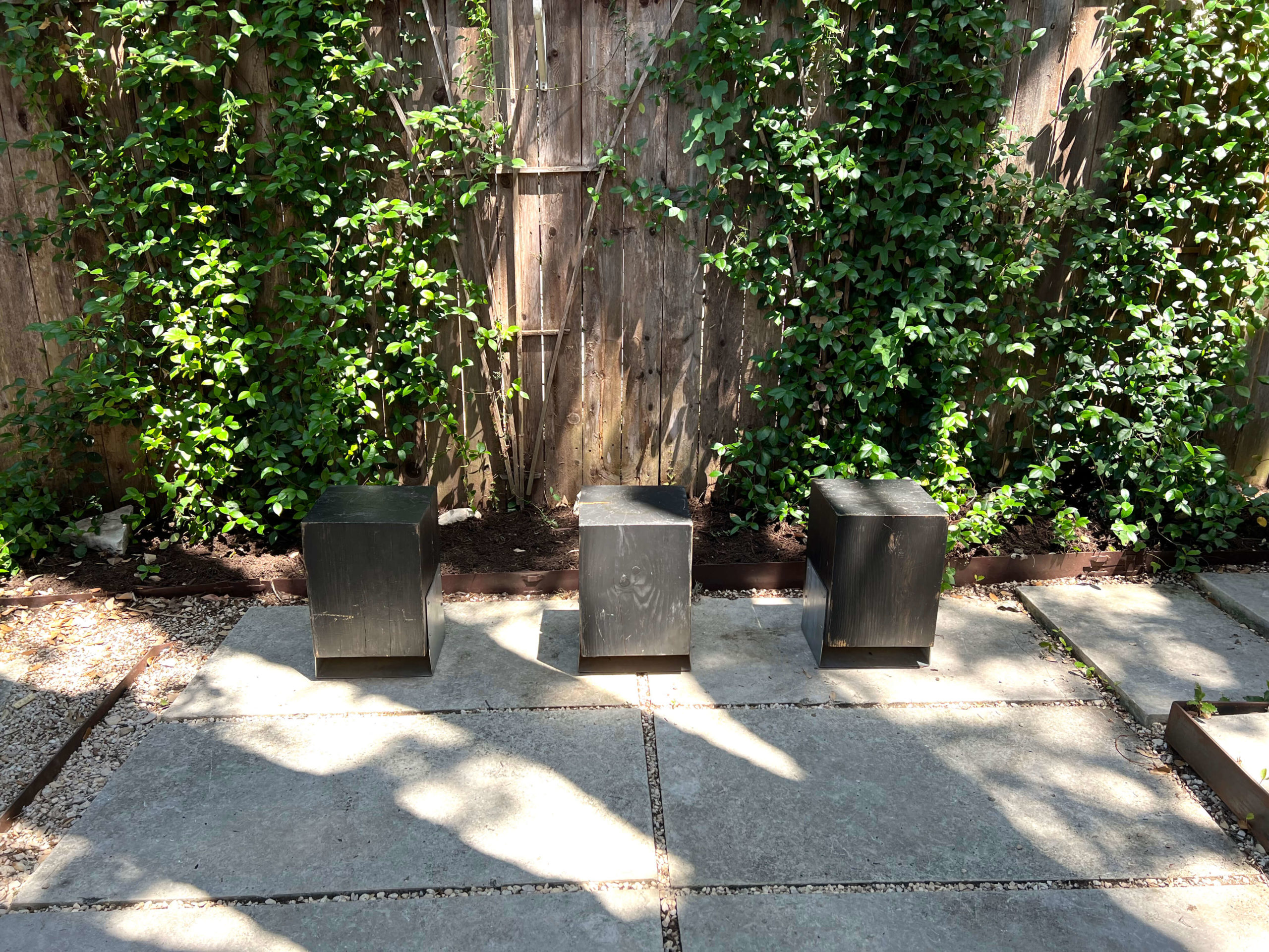 Black wood block stool from Round Top Fall Antiques Show at an Airbnb in Bouldin Creek at South Austin, Texas